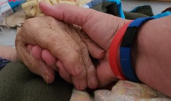 Simply holding someone's hand can bring hope